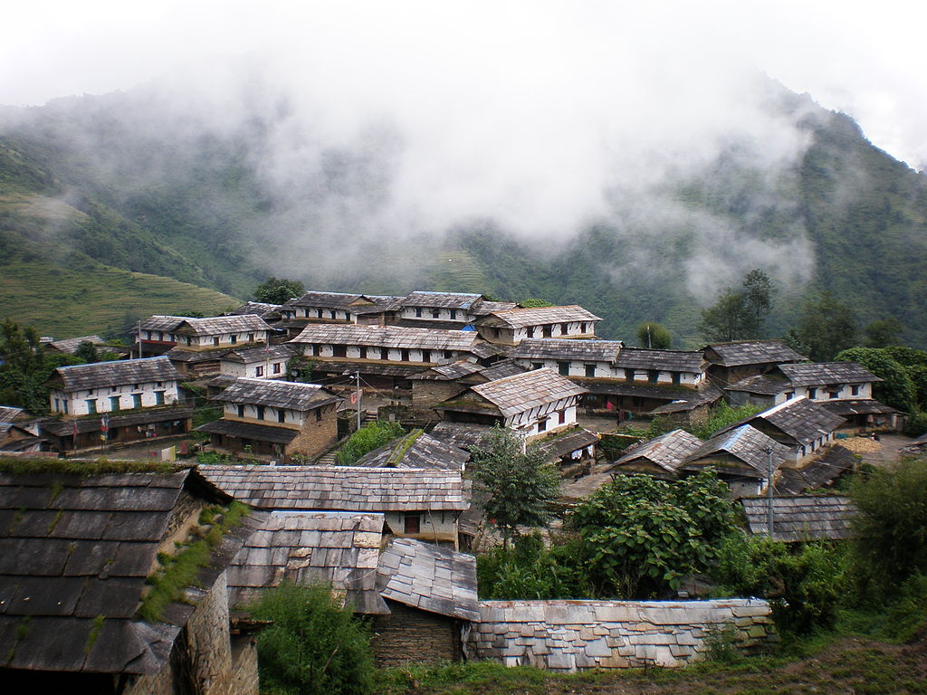Stone-paved Gurung village of Ghandruk with Annapurna range behind, Nepal