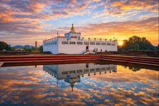 The Maya Devi Temple reflected in the sacred pond at Lumbini, Nepal